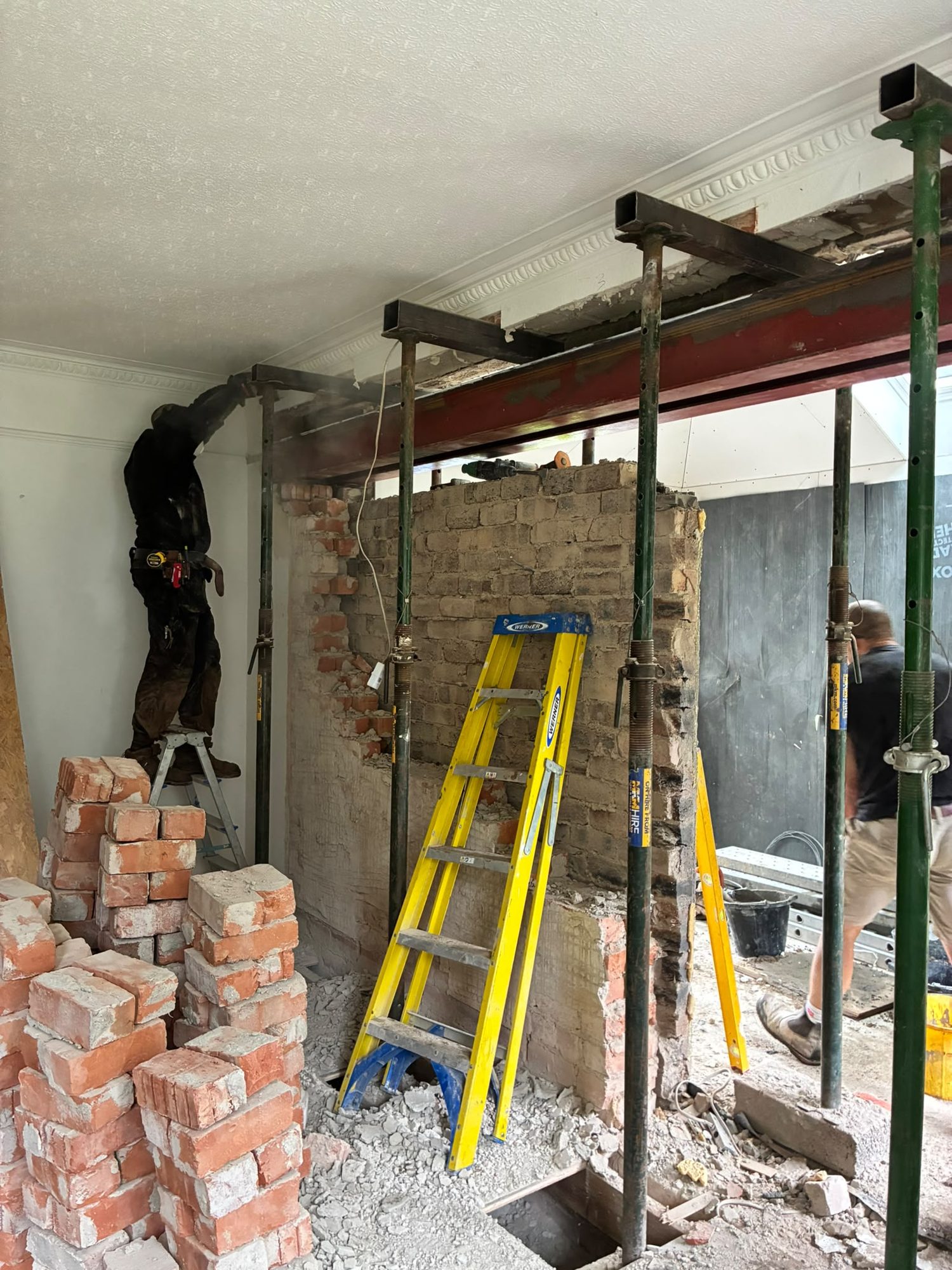 Removing a load-bearing brick wall beneath a new steel beam
