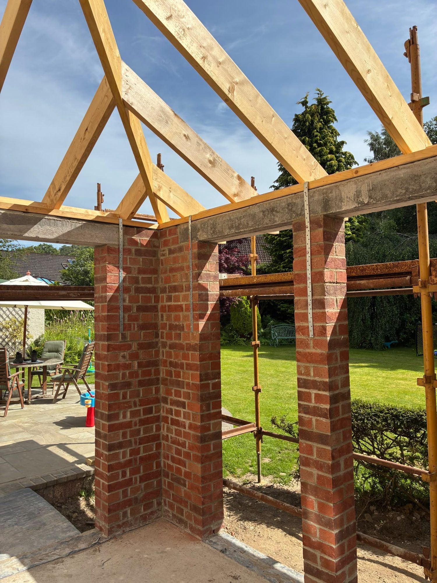 Brick piers and timber roof trusses built for a garden structure
