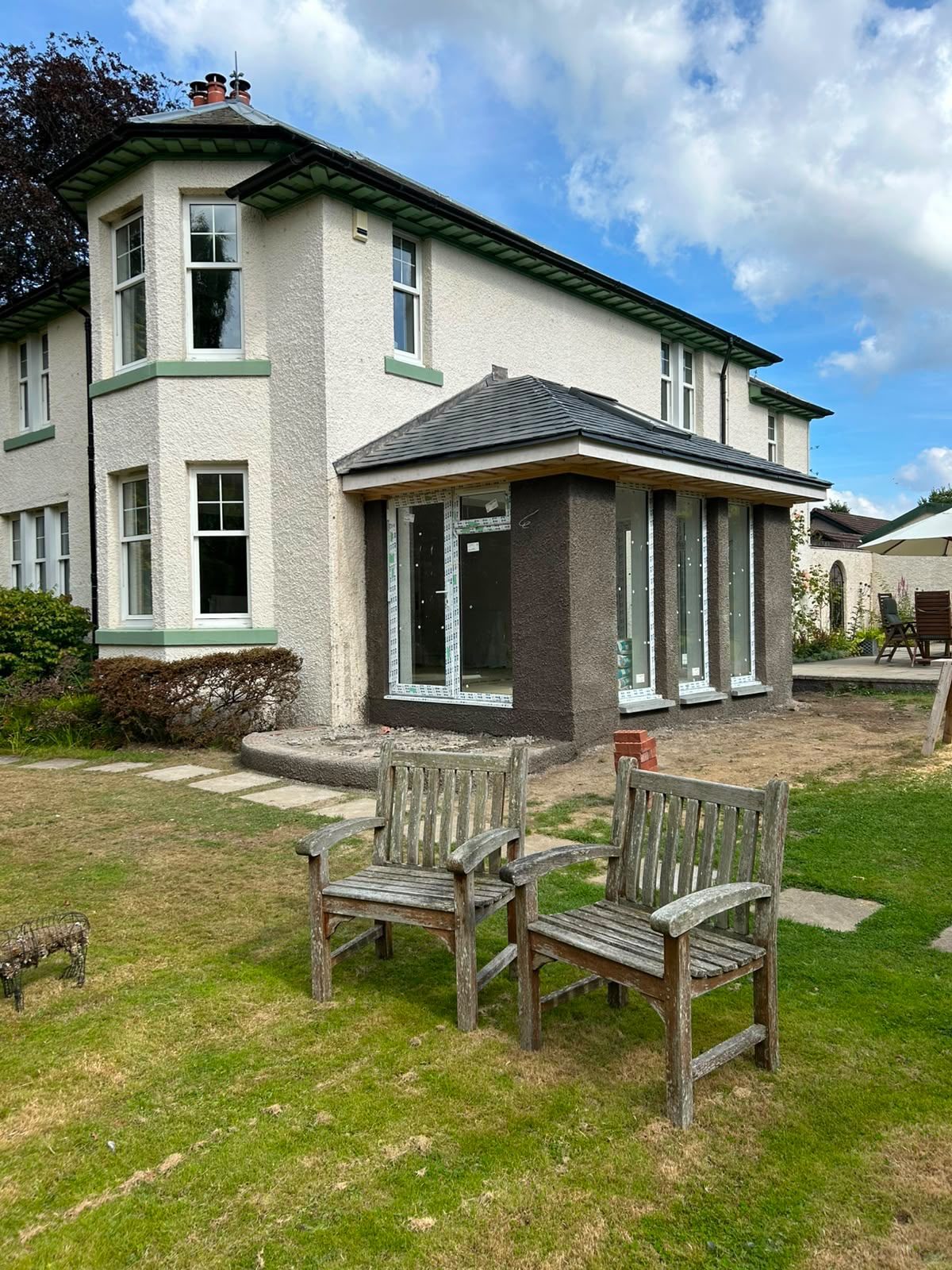 Single-storey house extension being rendered to match the existing home