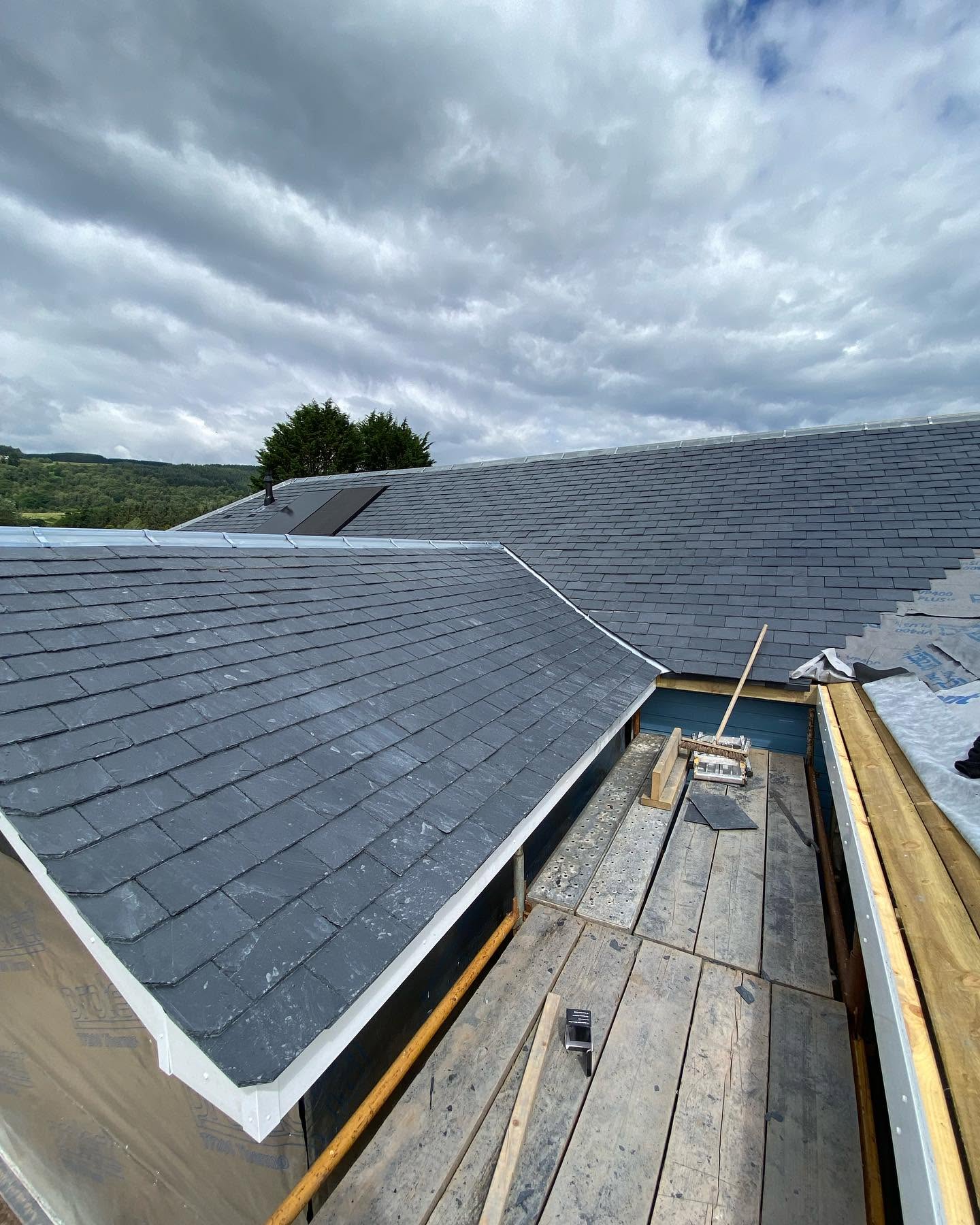 Slate roof with scaffolding alongside the eaves