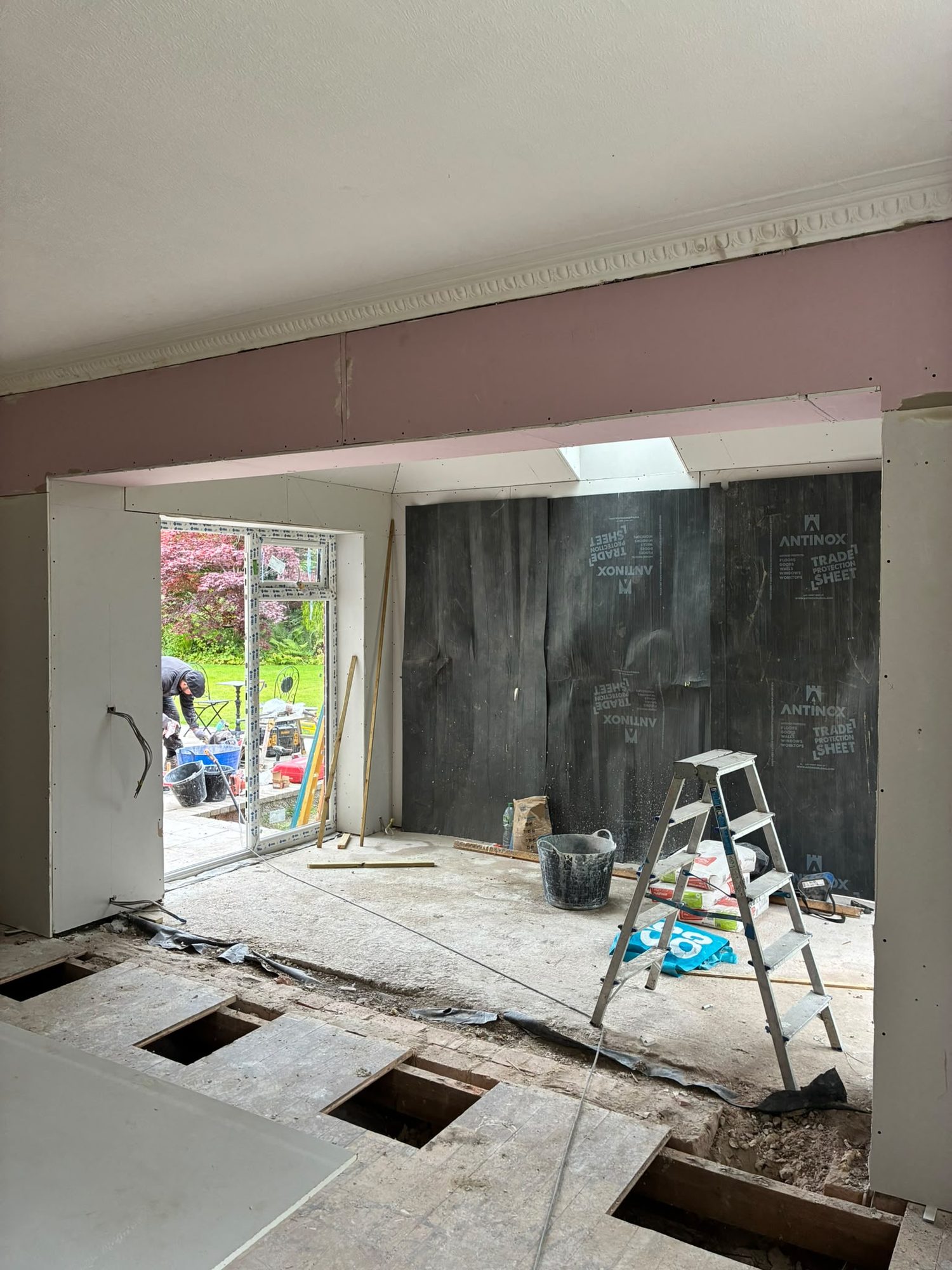 Structural wall opening formed to connect a home to its extension