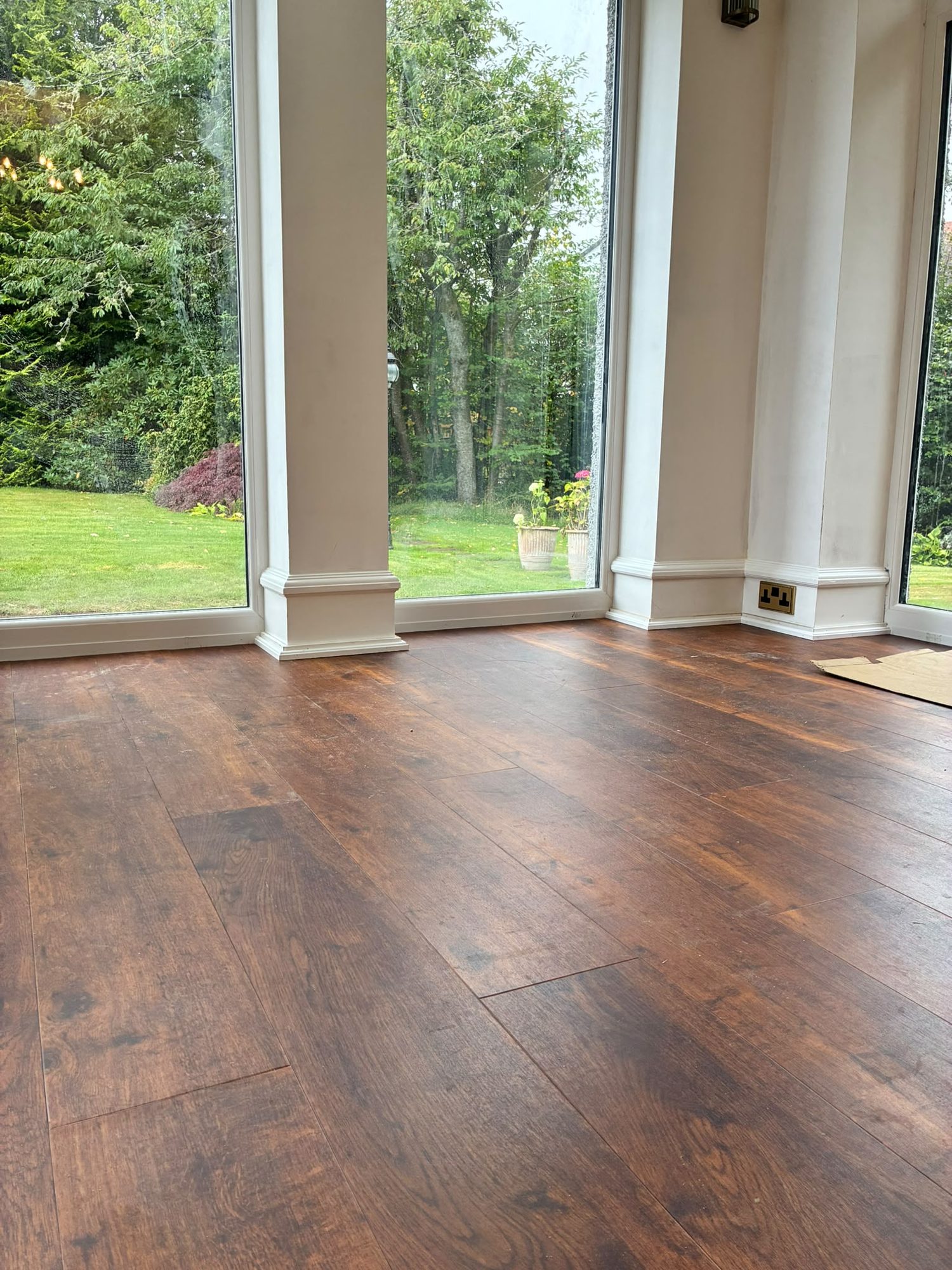 Hardwood floor laid in a bright garden room extension